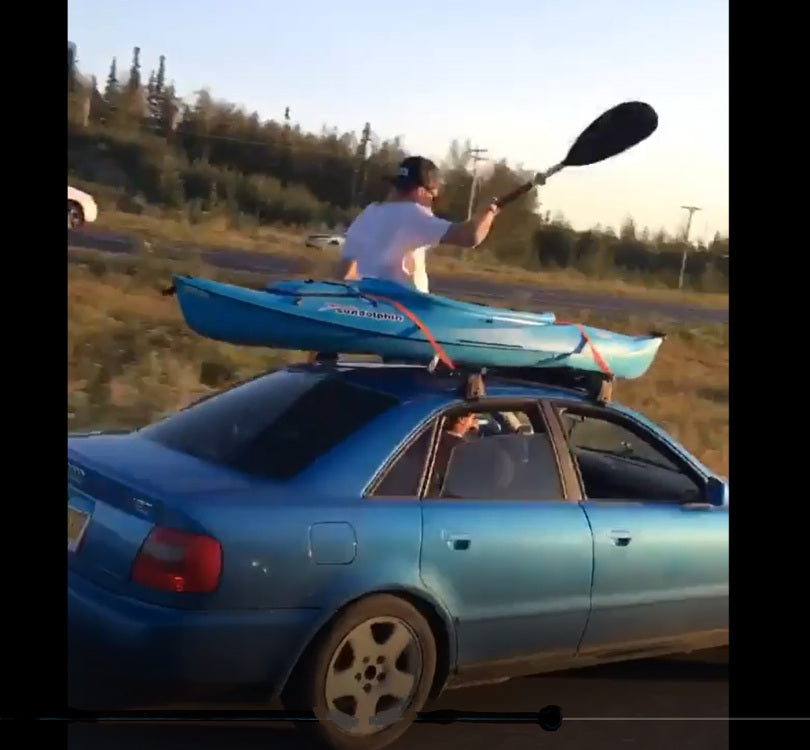 Kayak Strapped To Roof Of Car