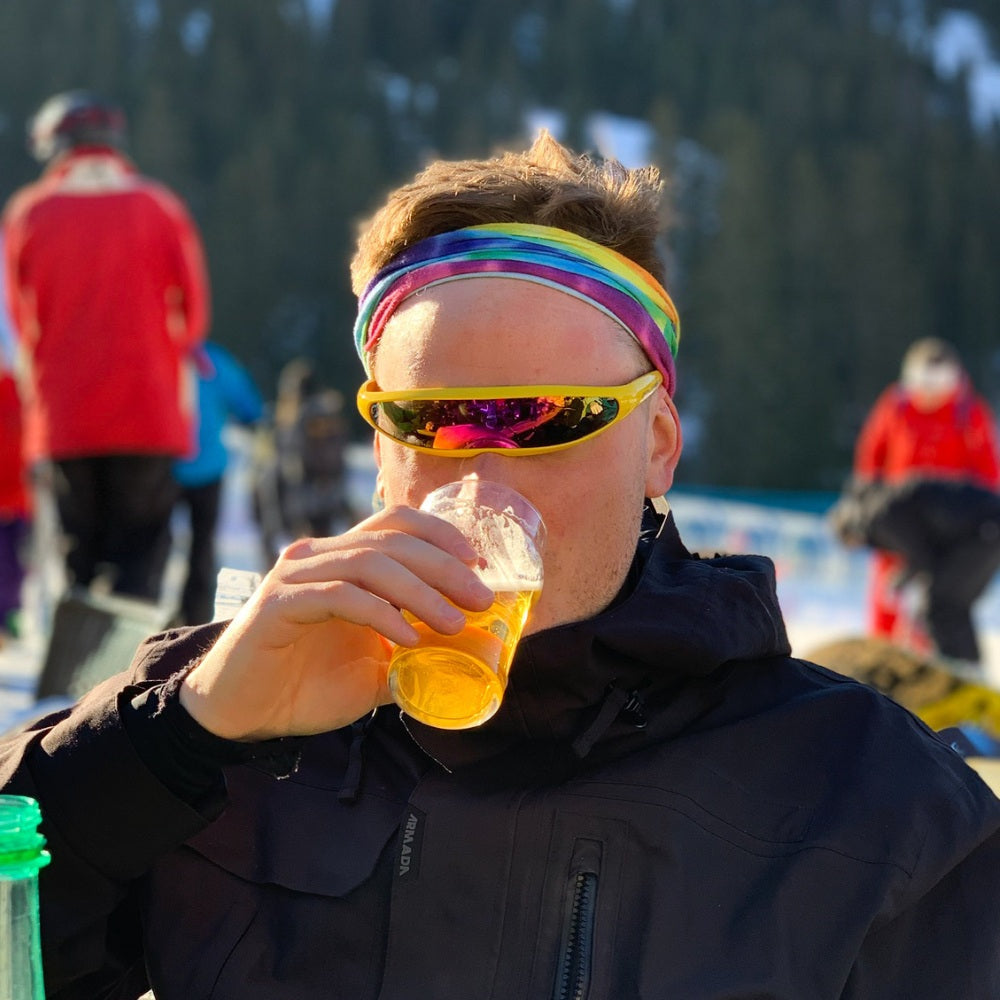 Jerry of the Day Send-O-Vision Jerry of the Day Glasses in yellow, man wearing outside drinking a beer. Funny ski and snowboard gifts, shirts, and apparel.