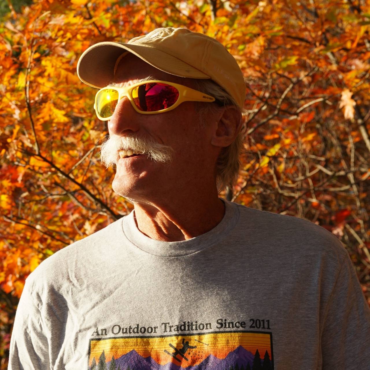 Jerry of the Day Send-O-Vision 10.0 The Jenius - Polarized person wearing the sunglasses in the forest. Funny ski and snowboard gifts, gear and apparel. 
