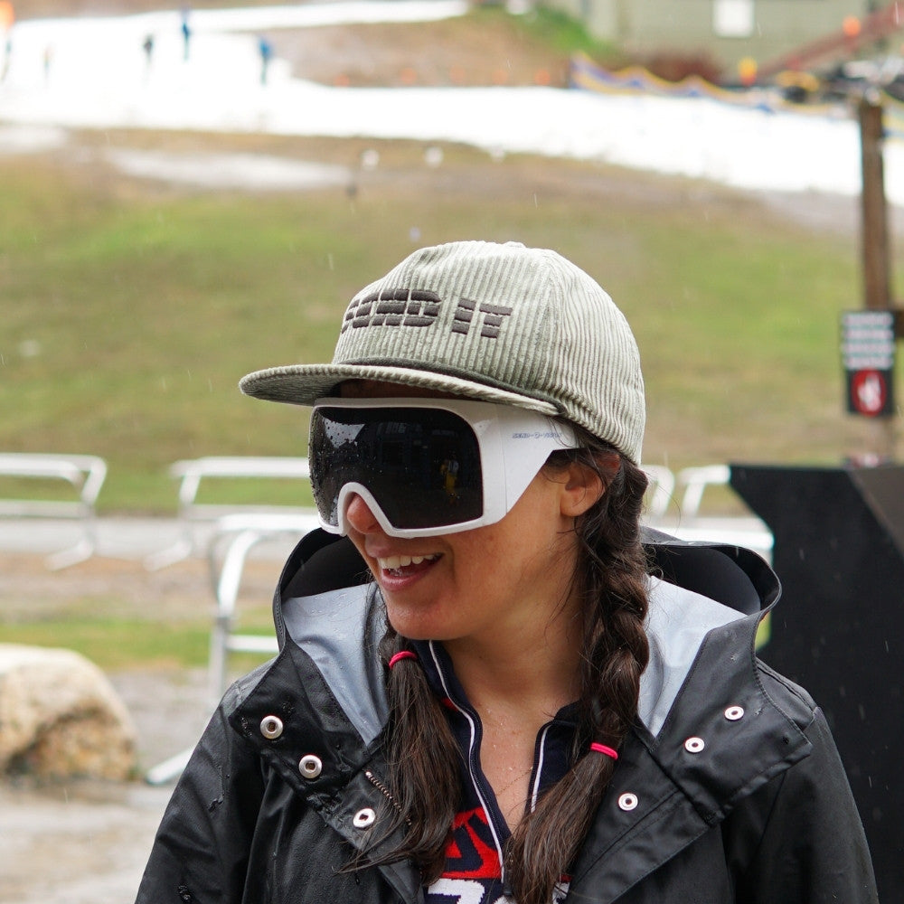 Jerry of the Day Send-O-Vision Magnum glasses in white, woman wearing at mountain with hat. Funny ski apparel and gifts.
