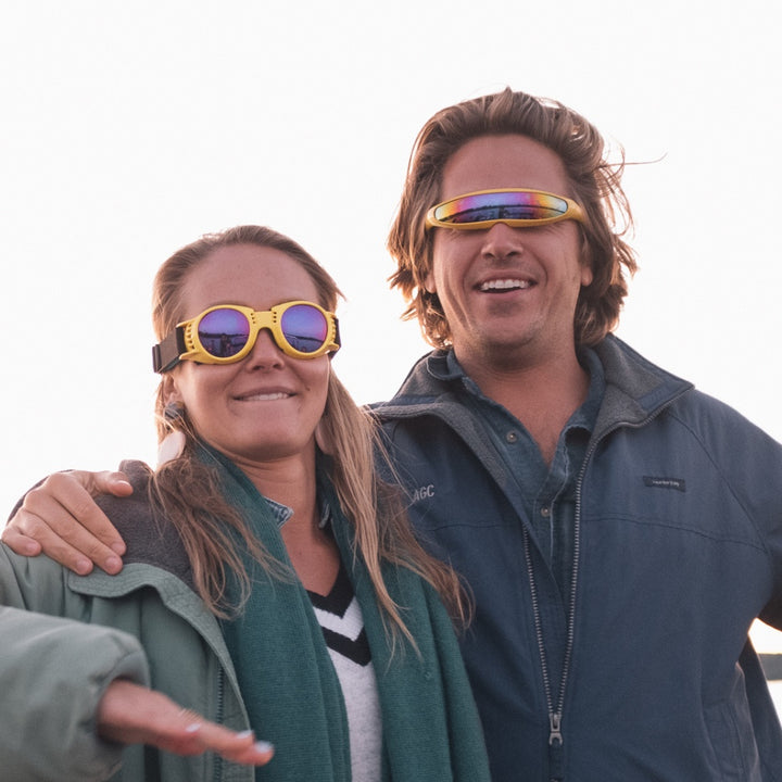 Jerry of the Day Send-O-Vision Jerry of the Day Glasses in yellow, man wearing outside with friend. Funny ski and snowboard gifts, shirts, and apparel.