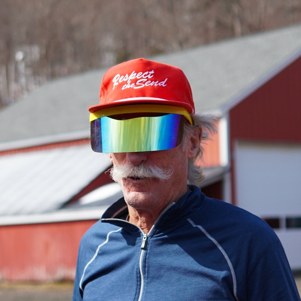 Jerry of the Dayglow Send-O-Vision 3.0 in yellow, man wearing at barn. Funny ski and snowboard gifts, shirts, and apparel.