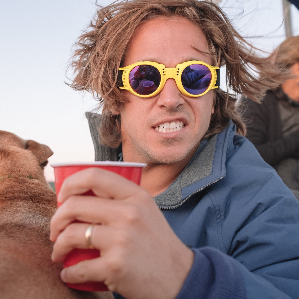 Jerry of the Day Send-O-Vision 2.0 Speed Goggles in yellow, man wearing with drink and dog. Funny ski and snowboard gifts, shirts, and apparel.