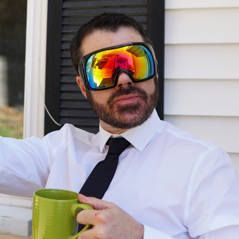 Jerry of the Day Send-O-Vision Magnum glasses in white, man wearing outside at event. Funny ski apparel and gifts.