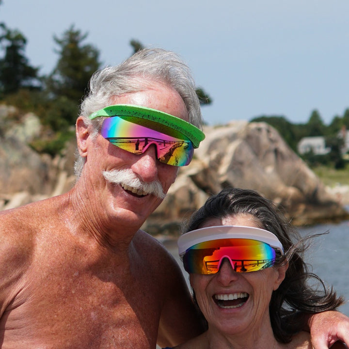 Jerry of the Day Send-O-Vision 8.0 the Sunsetter in green splatter and white couple wearing at lake.  Funny ski and snowboard gifts, shirts and apparel.