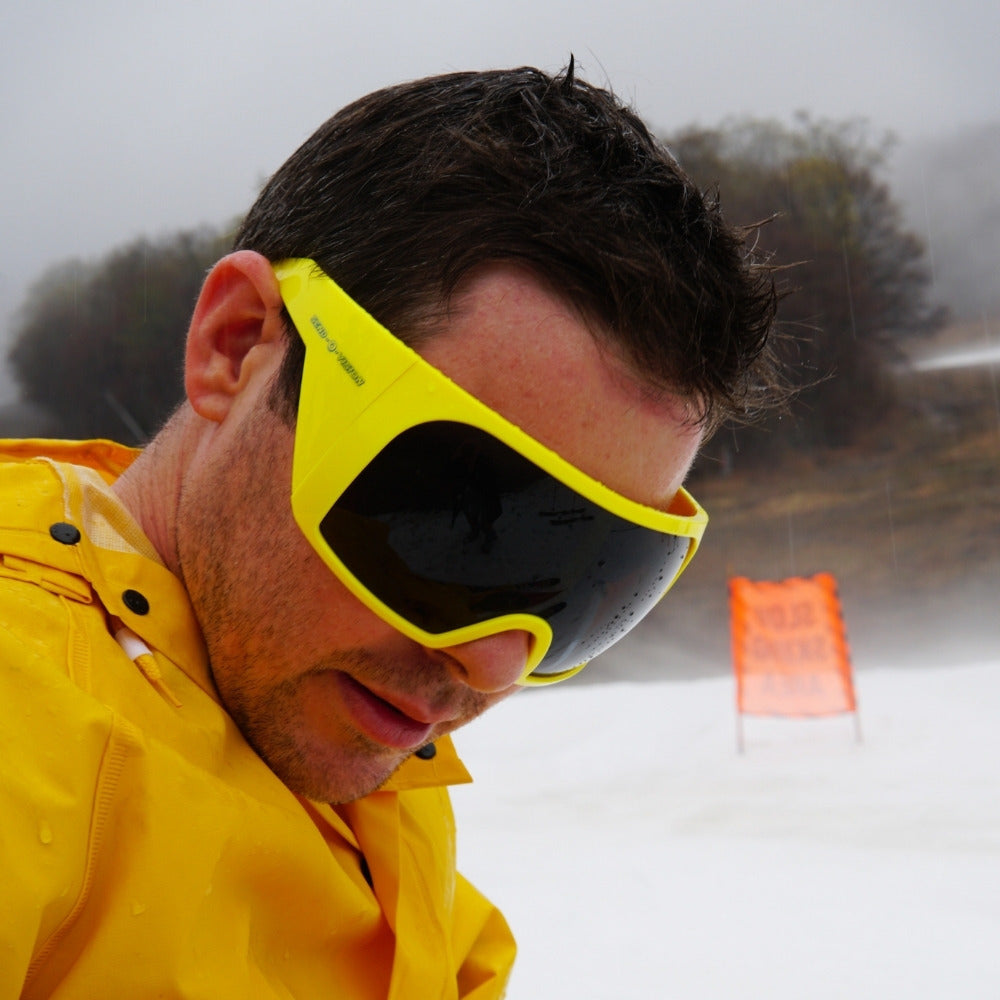 Jerry of the Day Send-O-Vision Magnum glasses in yellow, man wearing at ski race.  Funny ski apparel and gifts.