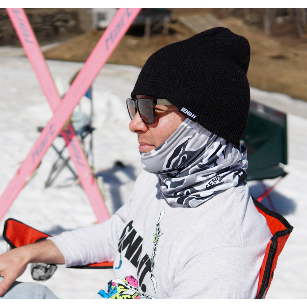 Jerry of the Day Send It Beanie in black, man wearing with skis. Funny ski and snowboard gifts, shirts, and apparel.
